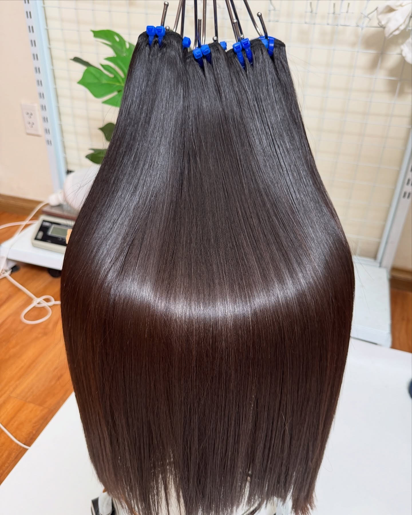 Brown raw Vietnamese straight hair bundle used as a color reference