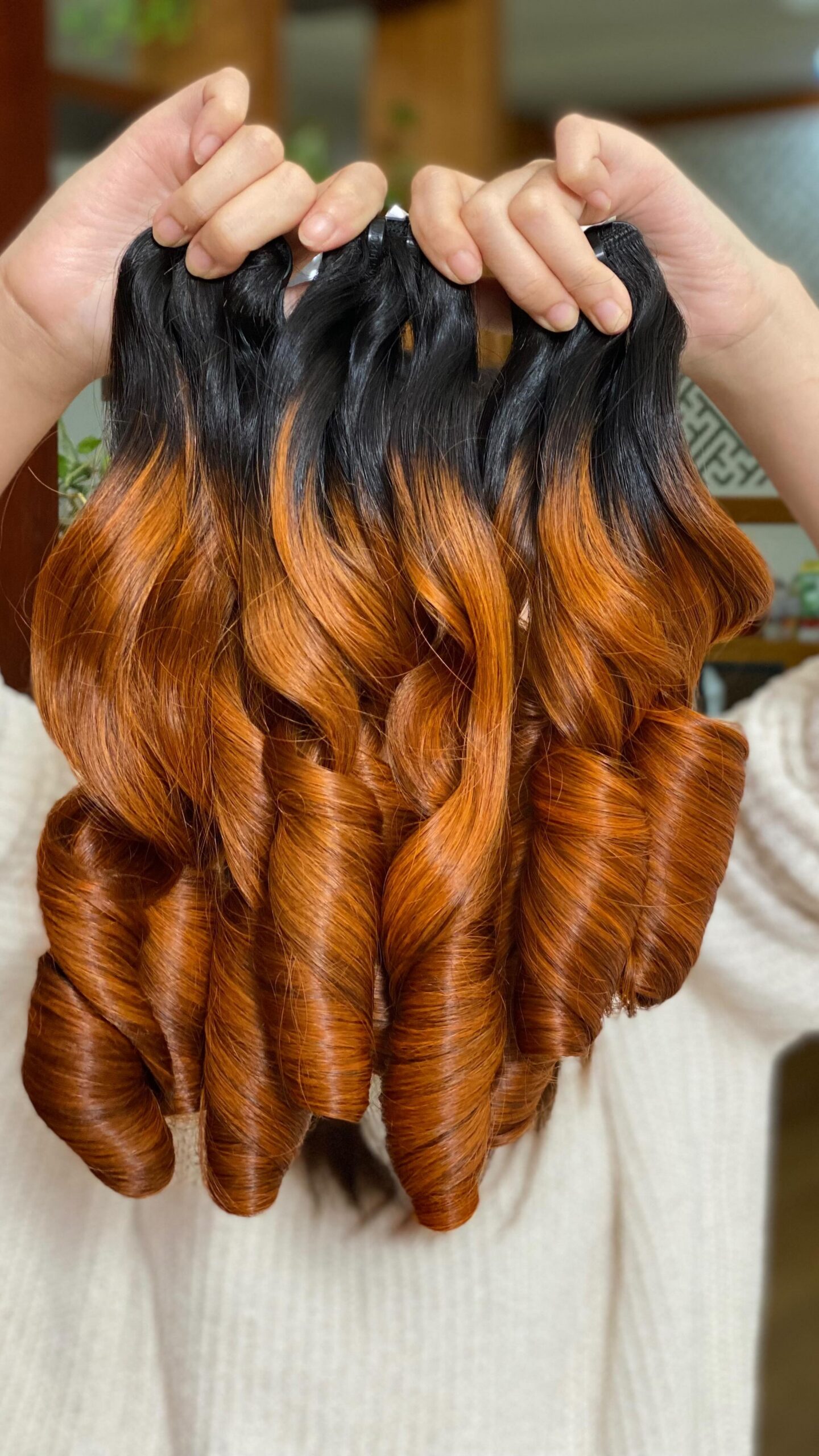 Orange raw Vietnamese body-wave human hair bundles