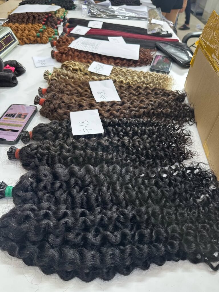 Assorted Vietnamese curly hair samples arranged for factory inspection